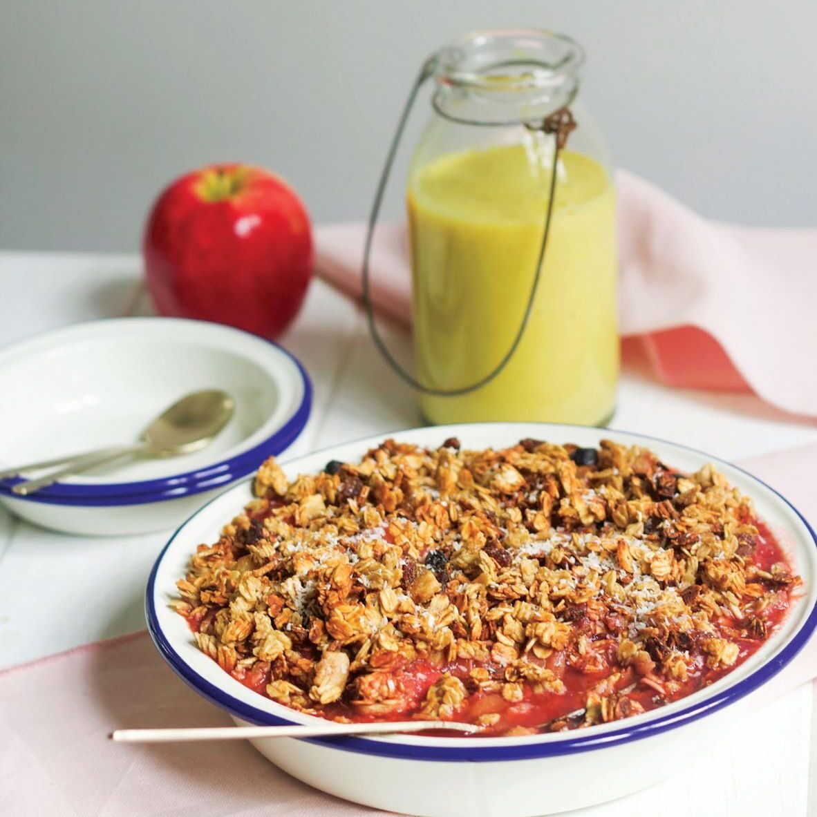Apple, rhubarb and strawberries with granola and turmeric custard