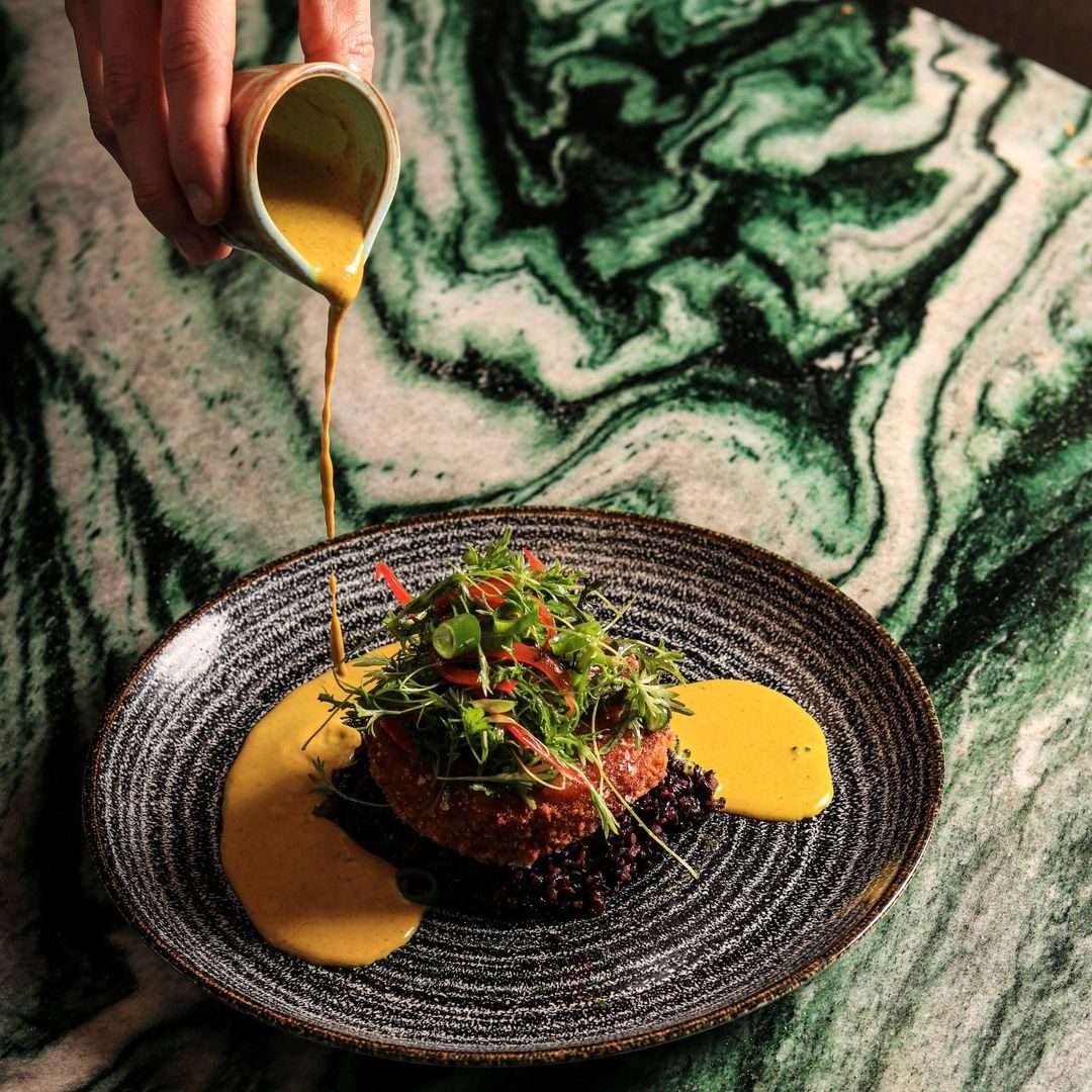 Butternut squash katsu with wild rice, spring onions and curry sauce