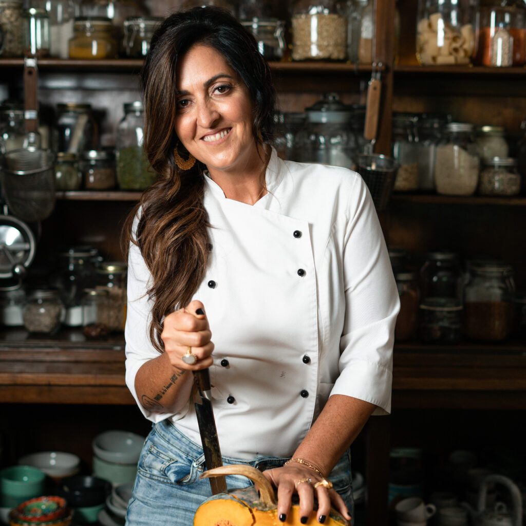 Chef Cynthia Louise in kitchen with pumpkin