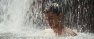 MILKED film still Chris under waterfall