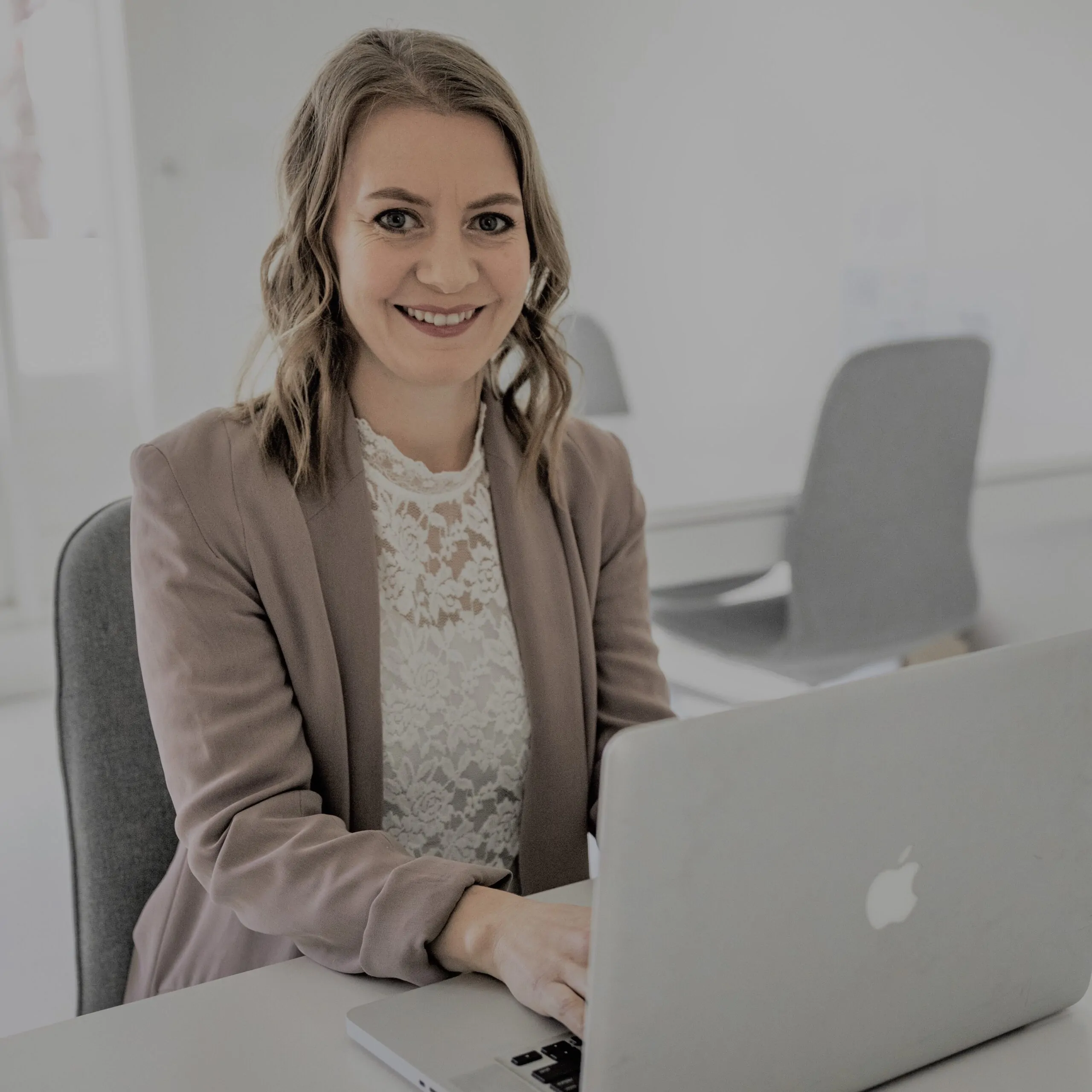 Aline Durr at her laptop - Vegan Interior Design