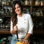 Chef Cynthia Louise in kitchen with pumpkin
