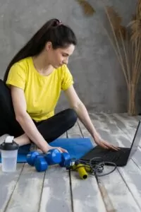 Interested,Latin,Woman,Watching,Online,Educational,Fitness,Workshop,Training,At