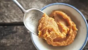 Miso in bowl on wooden table