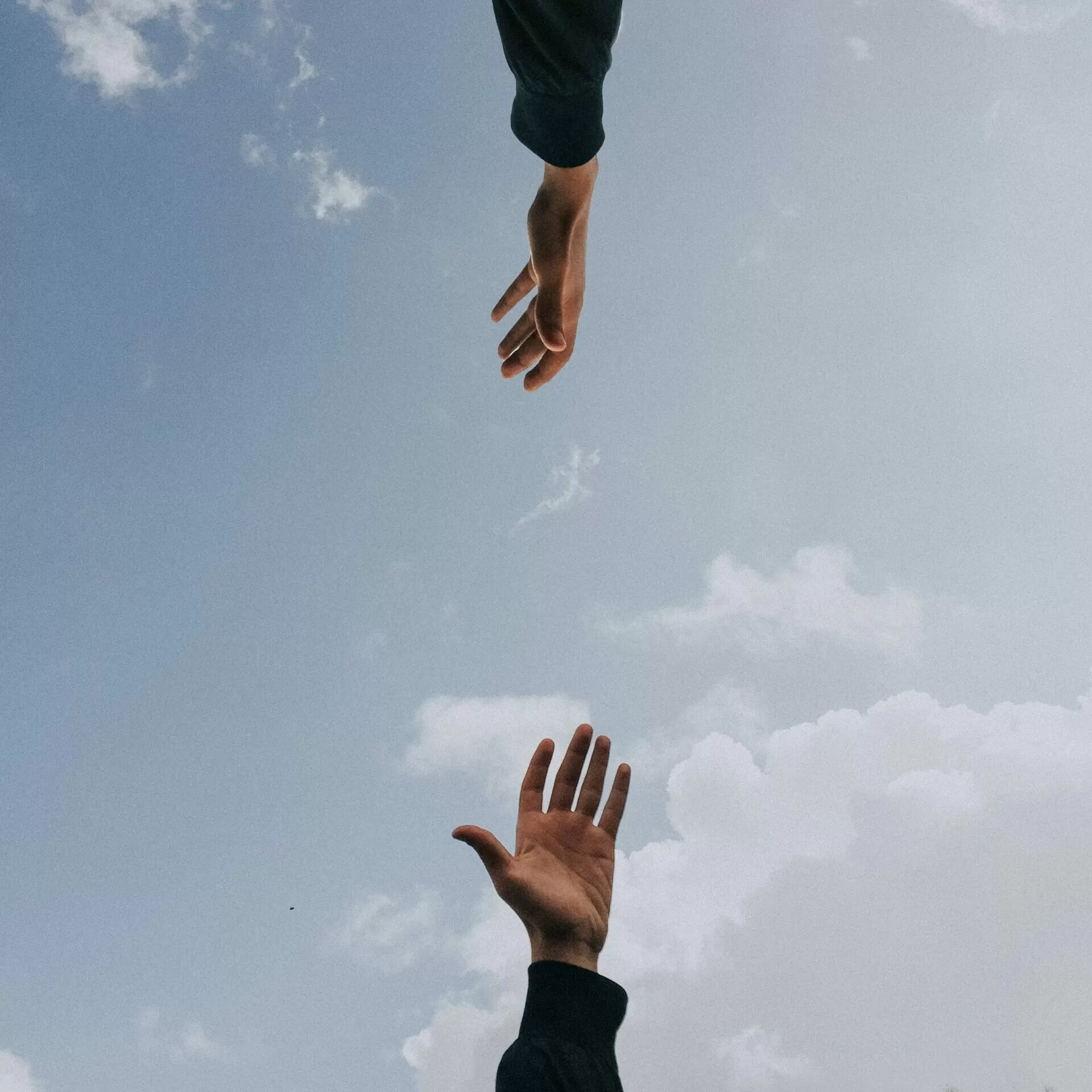 Hands reaching out for each other
